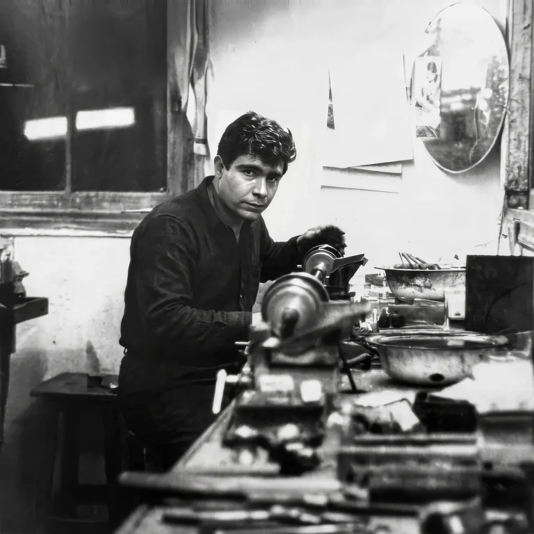 Haviv Moreno at work in his diamond workshop in an archival black-and-white photograph.